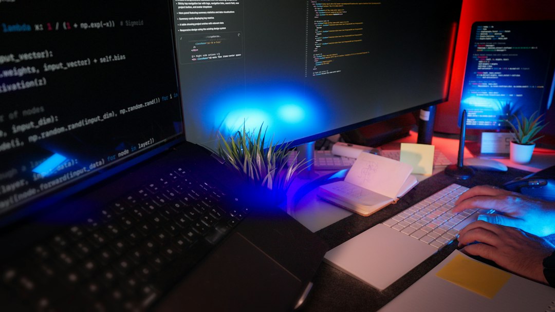 Web developer coding on a laptop